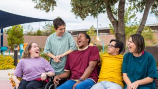 Group of young people with disabilities having fun together